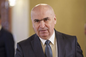 Bolojan: „În șase luni vor fi listate pe bursă companii din energie și transporturi”